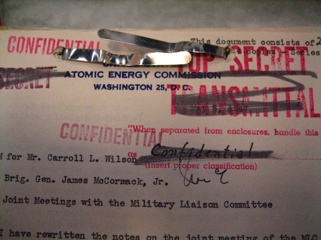 A typed document with confidential written in red all over it.