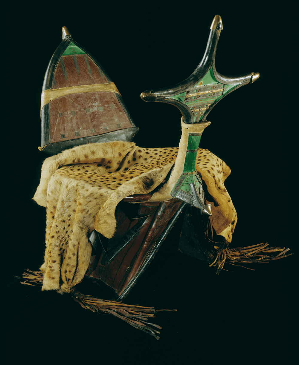 Camel saddle (tarik or tamzak), Algerian Sahara. Date unknown (probably 20th century). Leather, rawhide, wood, parchment or vellum, wool, silk, tin-plated metal, brass-plated metal, iron, copper alloy, and cheetah skin. 975-32-50/11927. Peabody Museum of Archaeology and Ethnology, Harvard University, Cambridge, MA, gift of the Estate of Dr. Lloyd Cabot Briggs, 1975, 975-32-50/11927. Photograph © President and Fellows of Harvard College, Peabody Museum of Archaeology and Ethnology.