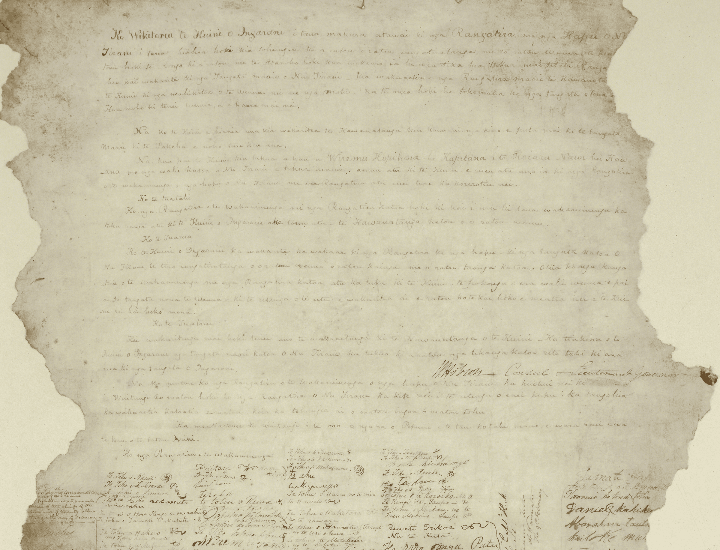 An uneven sheet of parchment, with faint handwriting and jagged edges.